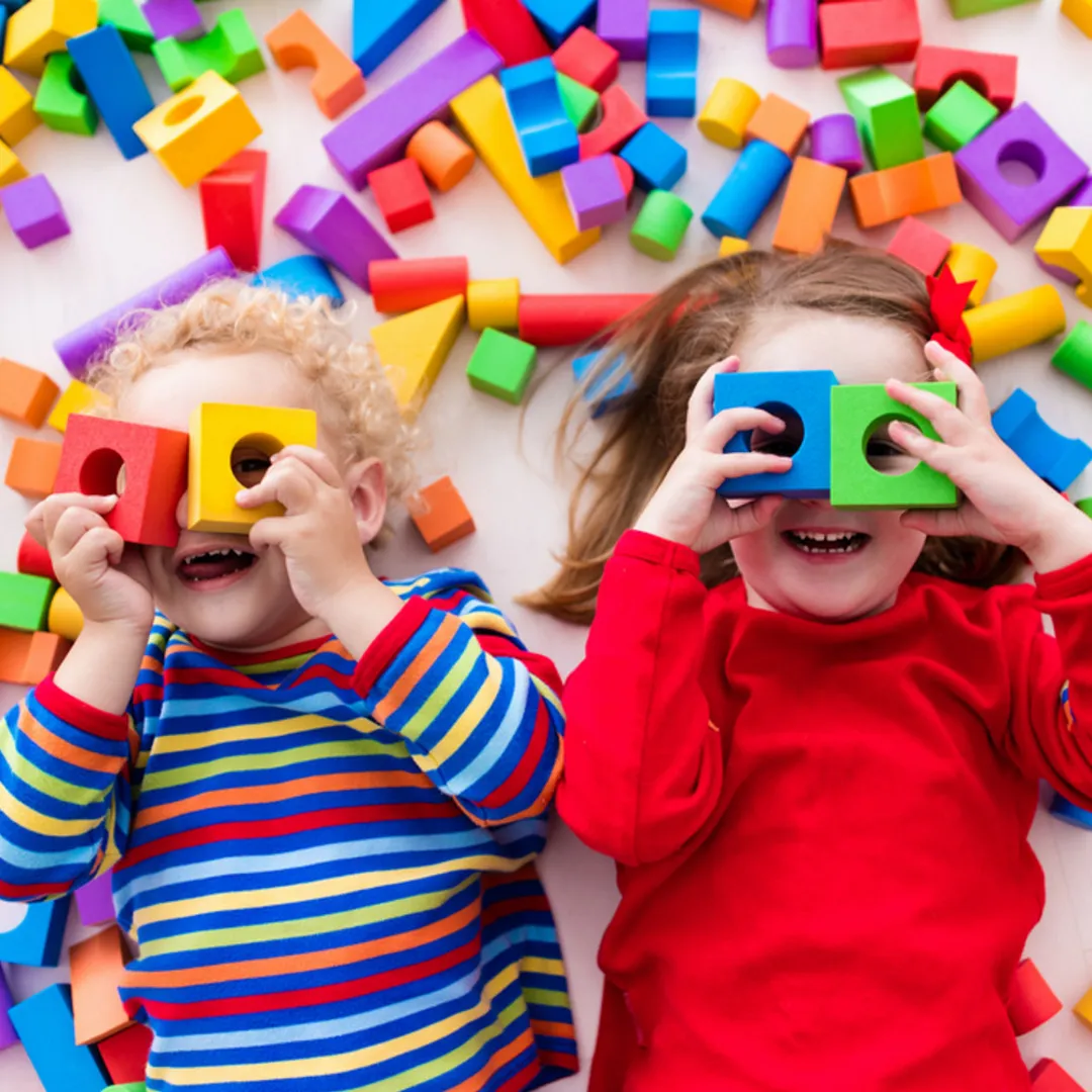 Children playing with colourful building blocks